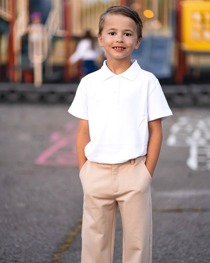 Full length portrait of Asian man wearing white shirt, khaki jeans and  backpack standing walking, front view isolated on white Stock Photo - Alamy